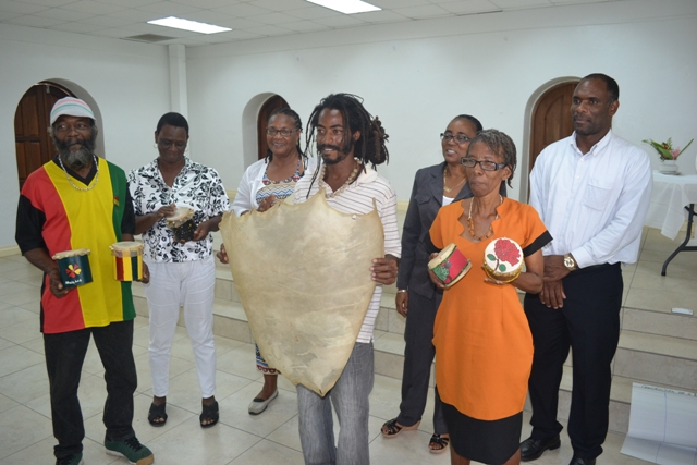 (Back row l-r) Earl Rawlins, Debra Griffin (front row l-r) Clyde Arthurton and Yvonne “Iona” Rogers participants of the Leather Tanning Workshop hosted by the Small Enterprise Development Unit (SEDU) in the Ministry of Finance in March, showcasing their work during a certification ceremony at the St. Paul’s Anglican Church Hall on April 14, 2016, with workshop facilitator Christobel Jeffers (back row third from left) Permanent Secretary in the Ministry of Finance Colin Dore (back row right) and head of SEDU Catherine Forbes (back row second from right)